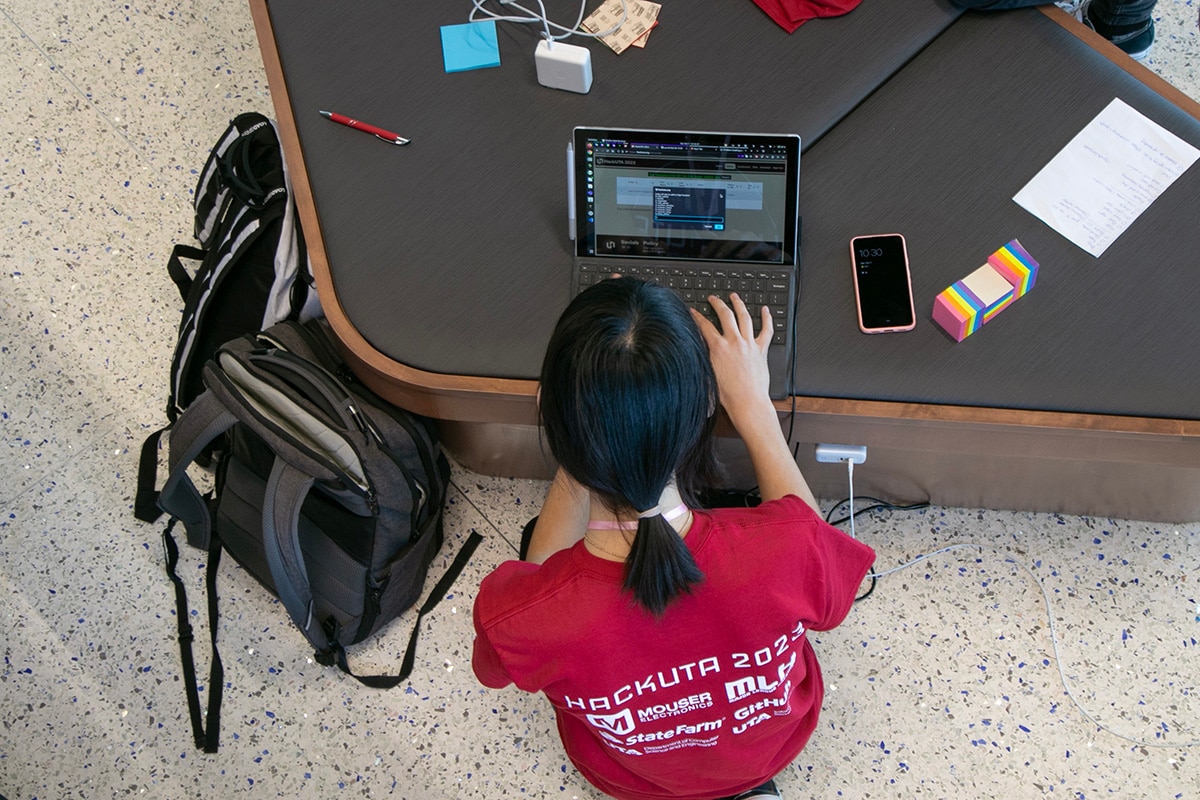 top view of woman working on a computer - opens in a new tab