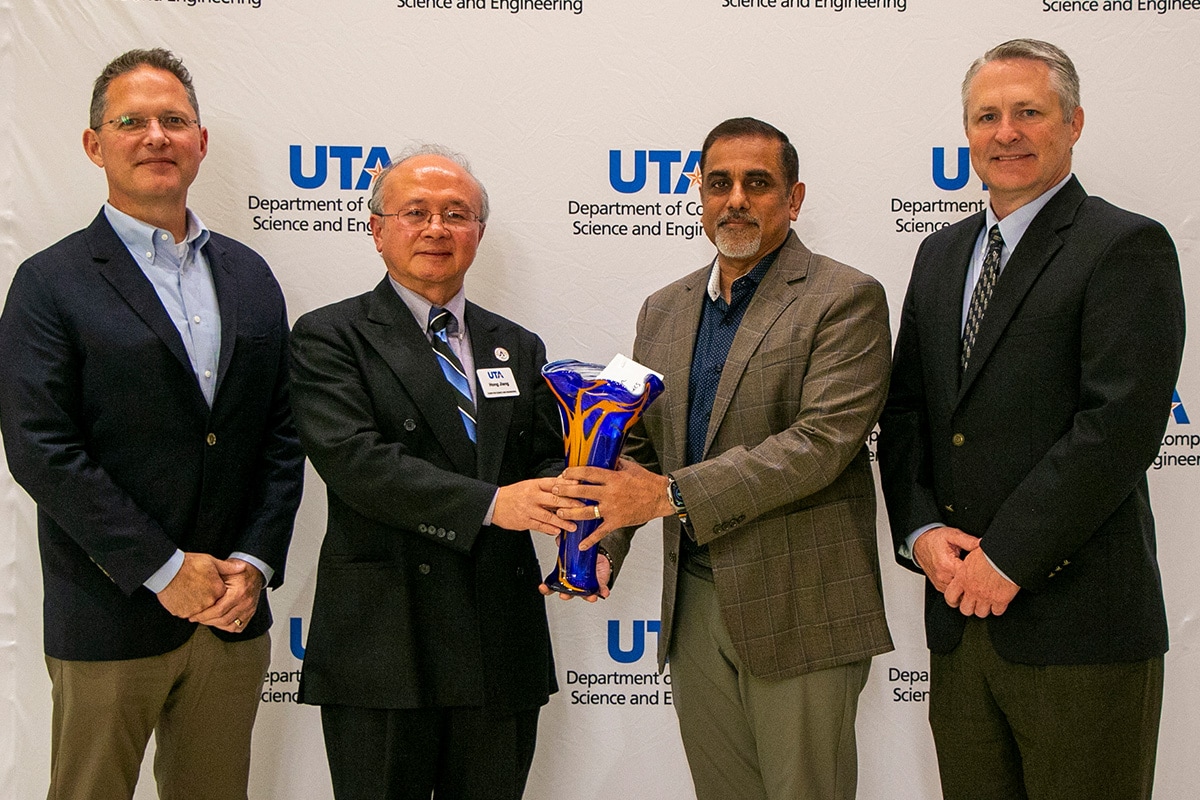 Award presentation photo with Hayne Shumate, Dr. Hong Jiang, Raju Shah, and Jeff Feemster - opens in a new tab