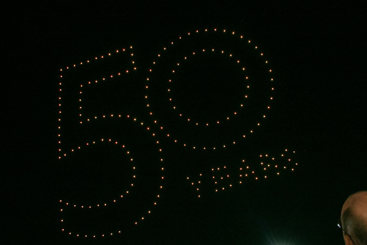 Drones against the night sky with lights spelling out 50 years - opens in a new tab