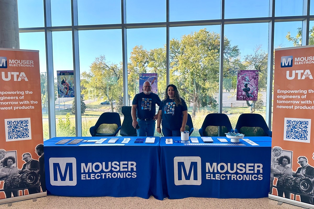 Two people standing behind a Mouser Electronics and UTA booth, smiling and facing twoards the camera - opens in a new tab